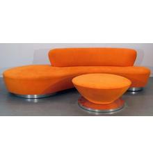 Sofa and ottoman set by Vladimir Kagan (German-American, 1927-2016), with an orange biomorphic serpentine sofa on aluminum feet and a round, tapered ottoman (est.  $6,000-$9,000).