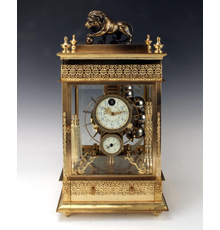 Rare 19th century French rolling ball waterwheel clock, almost identical to one in Palace Museum in the Forbidden City in Beijing, housed in a gilded bronze case (est.  $3,000-$5,000).  