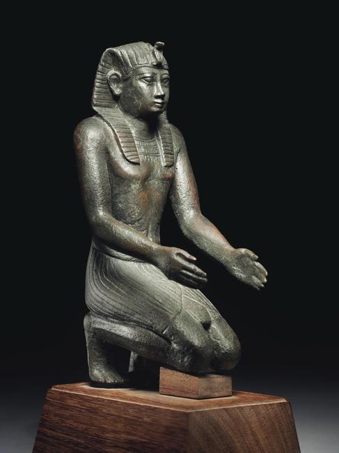 PROPERTY FROM THE CATTAUI FAMILY COLLECTION AN EGYPTIAN BRONZE FIGURE OF PHARAOH NECHO II LATE PERIOD, 26th DYNASTY, REIGN OF NECHO II, CIRCA 610-595 B.C.  Estimate: $150,000-250,000 