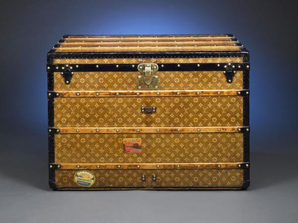 This captivating circa 1900 Louis Vuitton trunk exemplifies the style and grace of the golden age of travel.  This flat-top steamer case is covered with the familiar LV monogram on an early light brown handwoven canvas, and is finished with all original trim, including the marked latch metal trim, leather tags, beechwood slats and brass rivets.  Hotel stickers from around the globe attest to this trunk's travels far and wide.