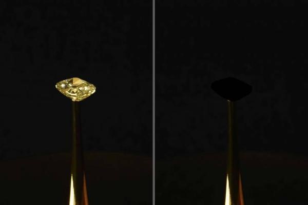 The MIT team cloaked a 16.78-carat natural yellow diamond in their material to show how it disappeared into darkness.