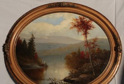 Norton Bush (American, 1834 - 1894): Autumn Scene in the Adirondacks - Oil on board, oval, 26 inches wide/Signed lower right