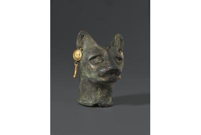 Cat's Head, 30 B.C.E.  to third century C.E..Bronze, gold, 2 3/8 x 1 3/4 x 1 13/16 in.  (6 x 4.4 x 4.6 cm).  Brooklyn Museum.  Charles Edwin Wilbour Fund, 36.114