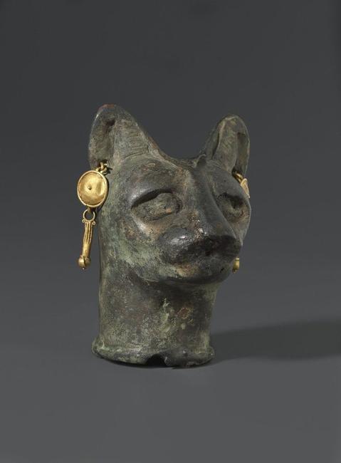 Cat's Head, 30 B.C.E.  to third century C.E..Bronze, gold, 2 3/8 x 1 3/4 x 1 13/16 in.  (6 x 4.4 x 4.6 cm).  Brooklyn Museum.  Charles Edwin Wilbour Fund, 36.114