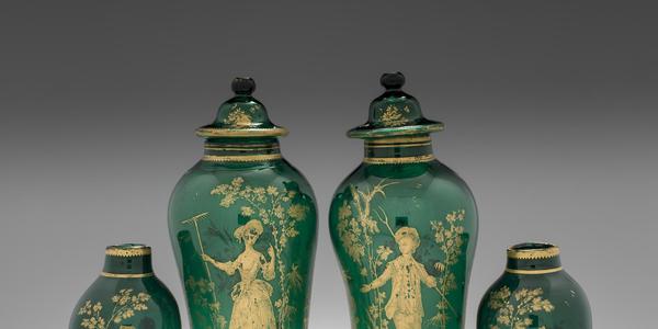 Pair of covered green vases, about 1765.  Probably the workshop of James Giles.  England, London.  Gilded copper-green lead glass.  H.  39.3 cm; Diam.  (max) 14.1 cm; and H.  39.7 cm; Diam.  (max) 13.9 cm.  The Corning Museum of Glass.