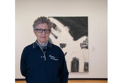 Louise Fishman with her 1996 oil painting "Blonde Ambition" at Krannert Art Museum, University of Illinois Urbana-Champaign, 2019.  Photo by Julia Nucci Kelly