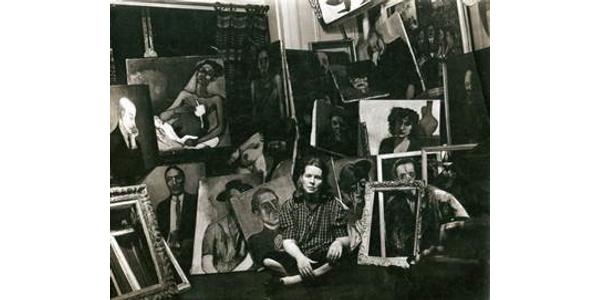 Alice Neel with paintings in her apartment, 1940.  Photo: Sam Brody.  © Estate of Alice Neel