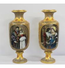 A large pair of French enameled faience, gold and platinum ground and Coraline decorated porcelain urns, 35 ½ inches tall ($8/12,000).