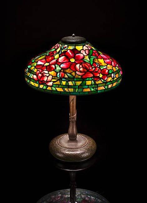 A fine Tiffany Studios Favrile glass and bronze Peony lamp, 1899-1918, estimate: $125,000 - 160,000 