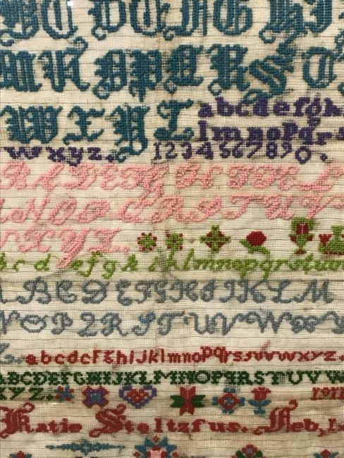 Among alphabet samplers is a Pennsylvania Amish sampler wrought by Katie Stoltzfus dated February 1, 1911, 25 ¾ by 18¼ inches.