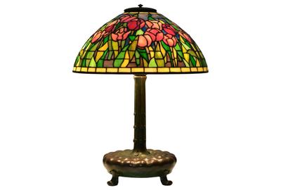 A standout among Tiffany Studios lighting here is this 21-inch tall “Tulip” table lamp ($30/50,000), circa 1910, with the shade impressed “Tiffany Studios, New York, 1906” and the base impressed “Tiffany Studios, New York, 364.” 