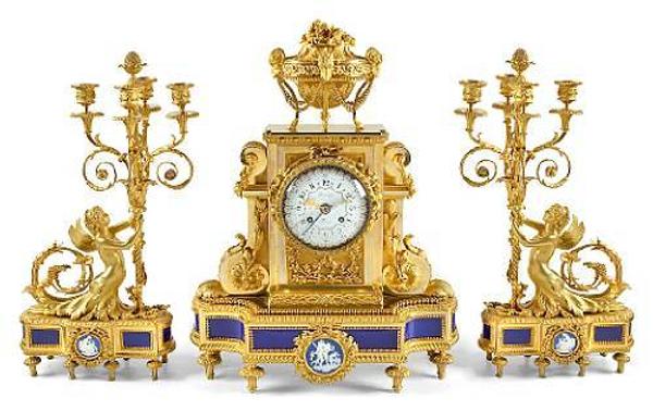 Lot No: 1218.  A Louis XVI style gilt bronze porcelain mounted clock garniture set.  Beurdeley, Paris, last quarter 19th century.  Estimate: $30,000 - 40,000