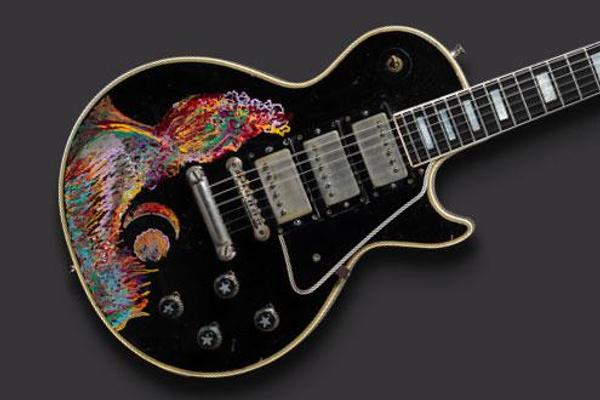 Gibson Guitar Corp.  (Kalamazoo, MI); painted by Keith Richards.  Les Paul Custom electric guitar (serial no.  7 7277), 1957; painted 1968.  Carved mahogany body and neck, ebony fingerboard, 24 3/4 in.  scale; black finish with hand-painted design; three patent-applied-for (PAF) humbucking pickups, three-way selector switch, two volume and two tone controls.  Collection of Keith Richards