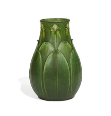 LOT 815: Marie A.  Seaman for Grueby, fine two-color vase with carved trefoil flowers and overlapping leaves.  Estimate $15,000-25,000 