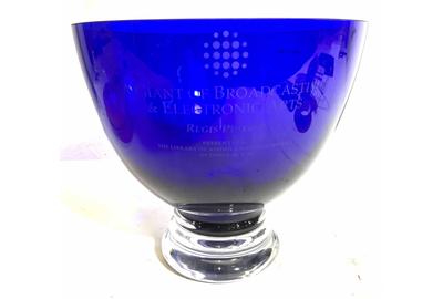 This elegant blue glass award made in Poland ($200-600) is inscribed “A Giant Of Broadcasting & Electronic Arts, Regis Philbin,” presented by the Library of American Broadcasting in 2014.