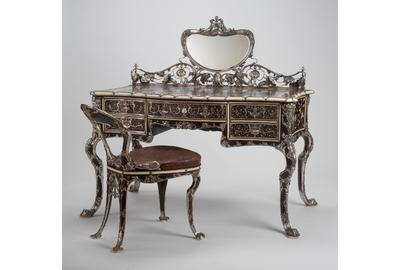 Martelé Writing Table and Chair, 1903, Gorham Manufacturing Company (est.  1831), United States, ebony, mahogany, boxwood, redwood, thuya wood, ivory, mother-of-pearl, silver, mirrored glass, and gilded tooled leather, Gift of Mr.  and Mrs.  Frederick B.  Thurber, RISD Museum, Providence, RI