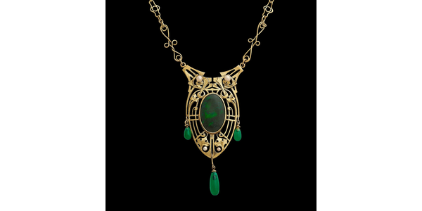 LOT 15: James H.  Winn pendant necklace on an original chain.  14K yellow gold, black opal, seed pearls, chrysoprase.  Sold for $23,750 