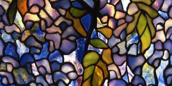  Detail.  Tiffany Studios, New York, Clara Driscoll (1861-1944), designer.  Wisteria Library Lamp, ca.  1901.  Leaded glass, bronze.  The Neustadt Collection of Tiffany Glass, Queens, NY.