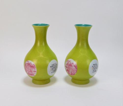 Pair of Chinese Qing Dynasty chartreuse raspberry porcelain vases, both 9 inches tall and each one decorated with two calligraphy cartouches and two landscape panels (est.  $1,000-$2,000).