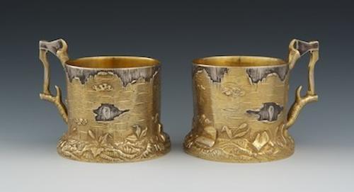 A Pair of Russian Silver and Gold Wash Trompe L'Oeil Tea Glass Holders, Marks of Ivan Khlebnikov with Imperial Warrant, Moscow, ca.  1900