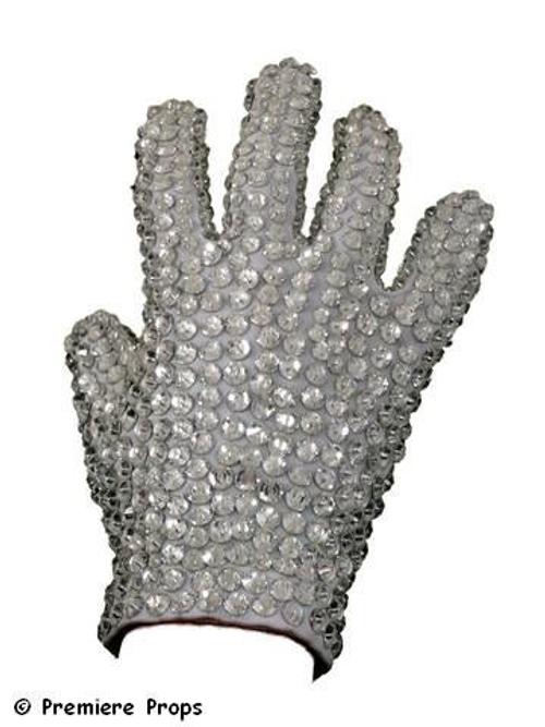 Actual glove worn on-stage by Michael Jackson during his “Victory” tour, a large white “tux-style” glove covered in crystals – palm front and back and all the fingers.  (est.  $50,000-$60,000).