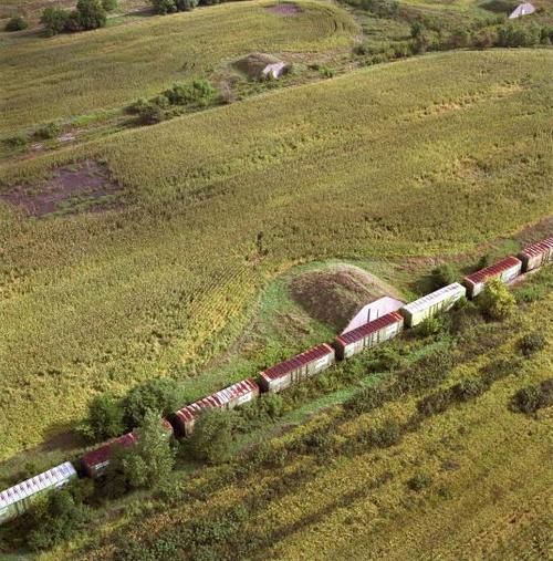 Terry Evans, American, Abandoned Bunkers and Train, Now a Cornfield, September 1995, from the series Disarming the Prairie, 1995.  Pigment print.  Harvard Art Museums/Fogg Museum, Richard and Ronay Menschel Fund for the Acquisition of Photographs, 2020.177.  © Terry Evans.  Courtesy of the artist.