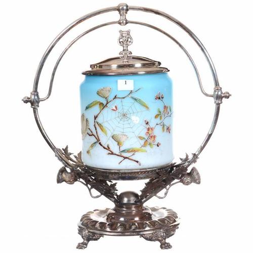 Victorian blue satin art glass biscuit jar, boasting enamel thistle and a spider web decor, set on an elaborate Wilcox #8444 silverplate frame.