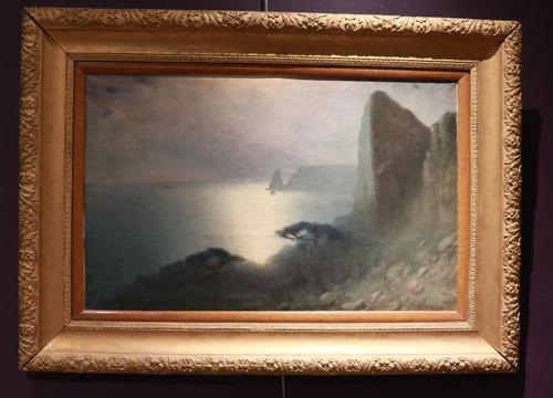 Oil on canvas painting by Russian Federation artist Kharlampi Kostandi (1868-1939), a pretty moonlight seascape measuring 24 inches by 30 inches (est.  $40,000-$60,000).