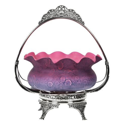 Agata art glass bowl with a rare pink to lavender coloring, outstanding mottling and a ruffled rim, offered with a Reed & Barton #968 silverplate frame, which works well to display the bowl.