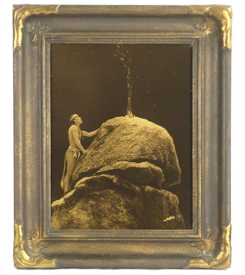 Goldtone photo by the renowned 19th century American photographer E.S.  Curtis (1868-1952), titled Signal Fire to the Mountain Gods, in the original frame (est.  $8,000-$16,000).