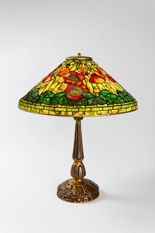 Macklowe Gallery- A Tiffany Studios New York wire mesh "Poppy" leaded glass and gilt bronze table lamp.  