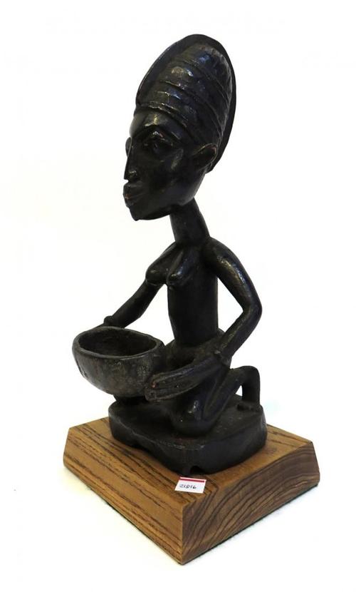 This 19th century African carved Yoruba figure, 12 1/2 inches tall, will be sold at auction May 23rd.