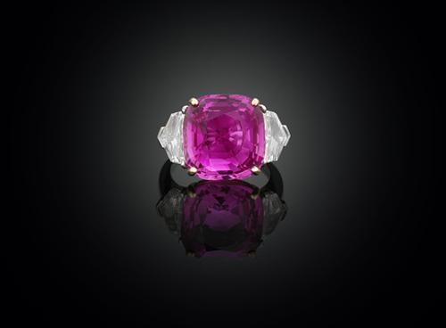 17.61 carat Ceylon pink sapphire and diamond ring is set in platinum and 18K yellow gold which brings out the "bubblegum" color of the center stone.