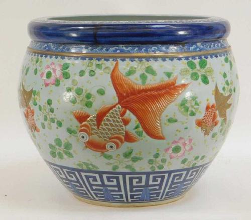 Chinese Qing Dynasty porcelain fish bowl, 19th century or earlier, finely decorated, with an incised band of goldfish swimming amongst lily pads and lotus flowers (est.  $2,000-$3,000).