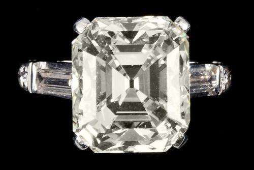 Impressive 9.90 carat Platinum and Diamond Ring, centering on one emerald cut diamond (est.  $80,000-$100,000)