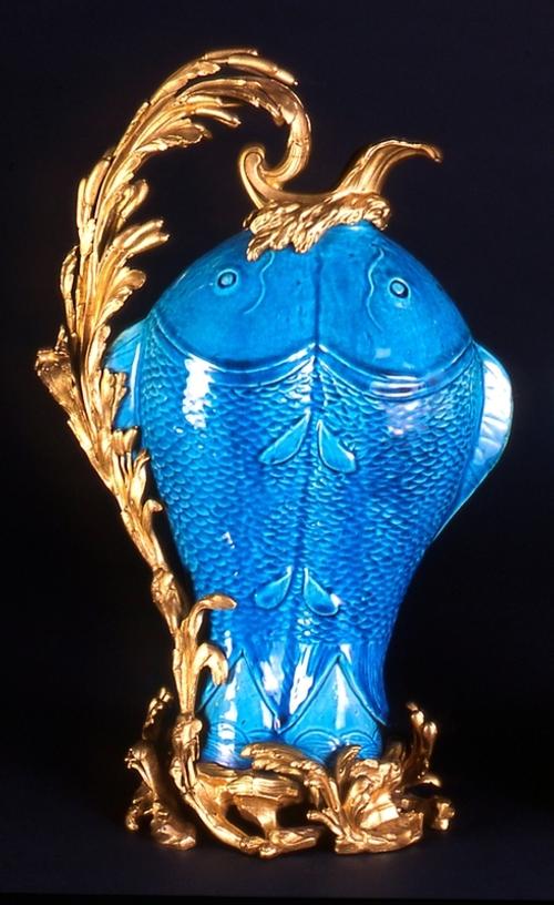 Peacock blue fish vase with ormolu mount Qing dynasty, Jiaqing reign (1796–1820); Gilt bronze mounts in Louis XV style, 19th century Porcelain, overglaze enamel or enamel-on-biscuit decoration 17 x 10 ¼ x 6 ¾ in.  (43.2 x 26 x 17.1 cm) Gift of The Leo and Doris Hodroff Collection, 2003.181.2a-b 