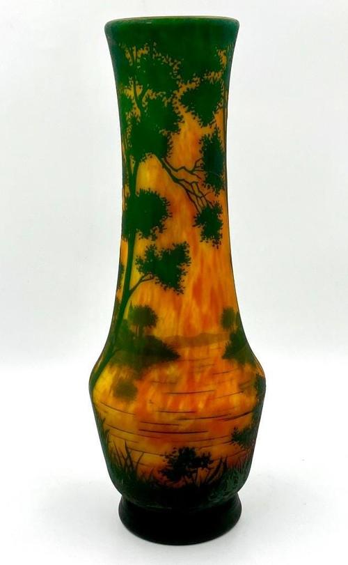 Daum Nancy glass vase of baluster form, 21 inches tall with a tall extended neck, colorfully decorated walls, signed with the Croix de Lorraine in cameo.  Estimate: $2,500-$5,000.