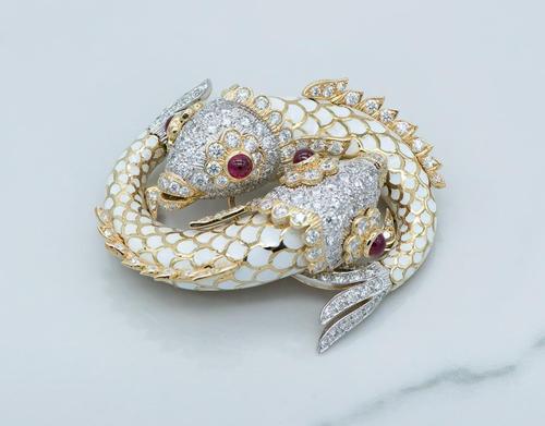 Rare and brilliant David Webb enamel and ruby double fish brooch in the original box (est.  $12,000-$20,000).