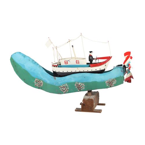 Important whirligig in tin of a white ship on blue seas by Quebec artist Ernest Joly, circa 1970, rocks back and forth when the propeller turns, captain at the helm (estimate: CA$2,500-$3,000).