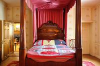 Log Cabin Quilt, 1990, by Polly Raymond of Gee's Bend, AL, graces the Parlor Bedroom's mahogany four-poster bed as part of the Community Threads quilting exhibition at Hill-Stead Museum, on view through March 28, 2010.  Photo by Ben Jordan.